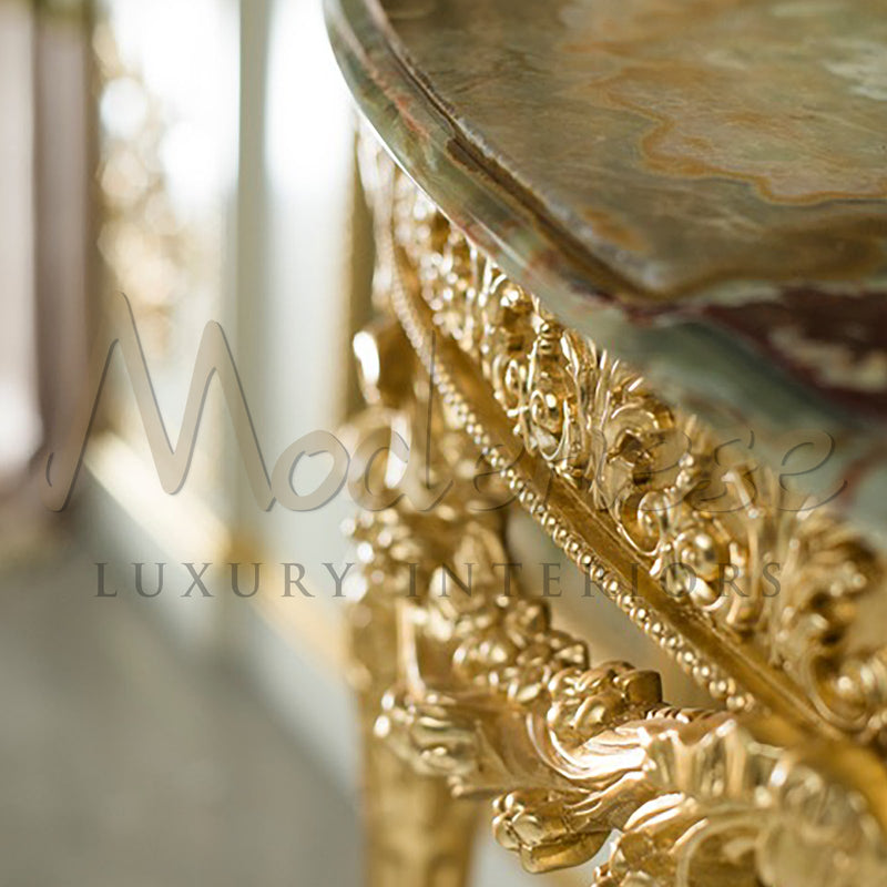 Artisanal Empire Console In Gold Leaf With Onyx Top And Handmade Carvings - Console Table - Modenese Luxury Furniture & Lightings - classic baroque furniture, classic french furniture, french palace decoration, hand carved table, high-end console table, high-end italian furniture, imperial console table, italian made furniture, louis xv furniture, luxury classic furniture, luxury console table, luxury decoration, luxury furniture brand, luxury Italian furniture, luxury living room sets, luxury marble top ta