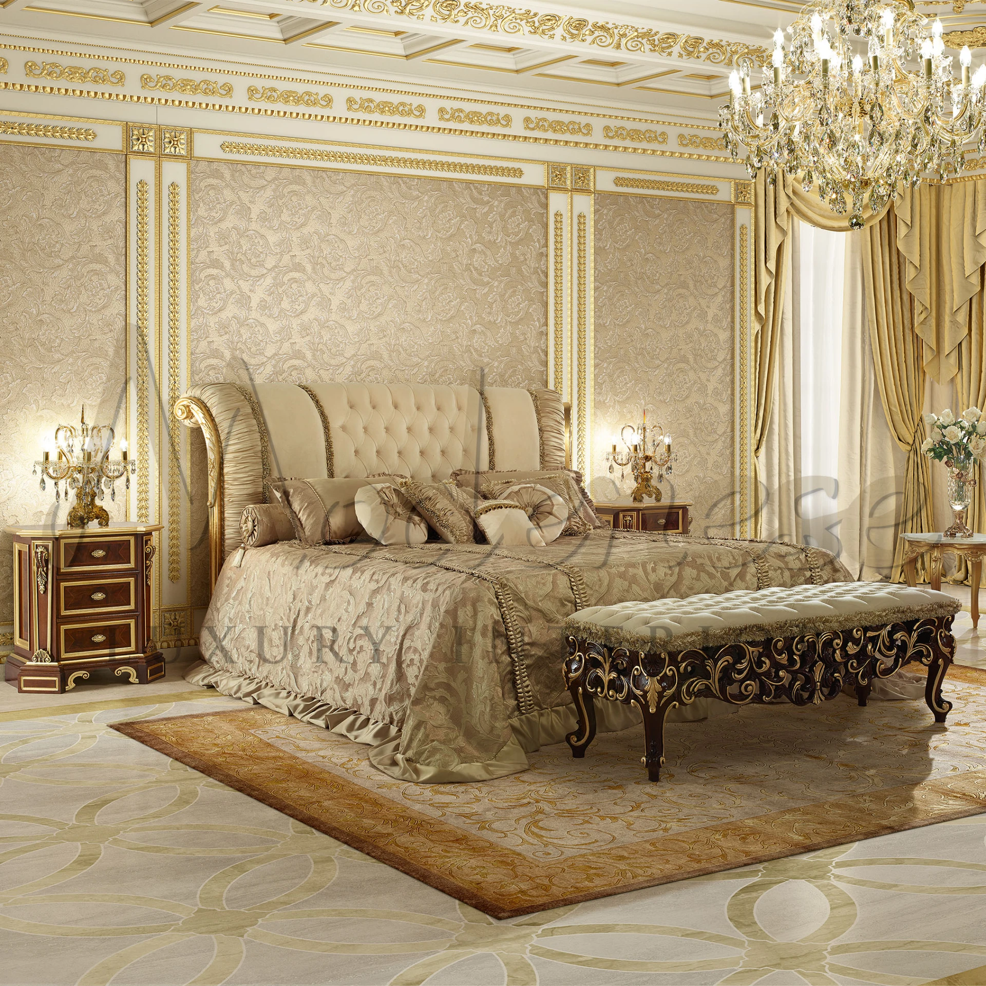 A lavish bedroom with a tufted headboard bed, opulent gold accents, an elegant bench, and intricate nightstands, all under a grand chandelier. Made in Italy.