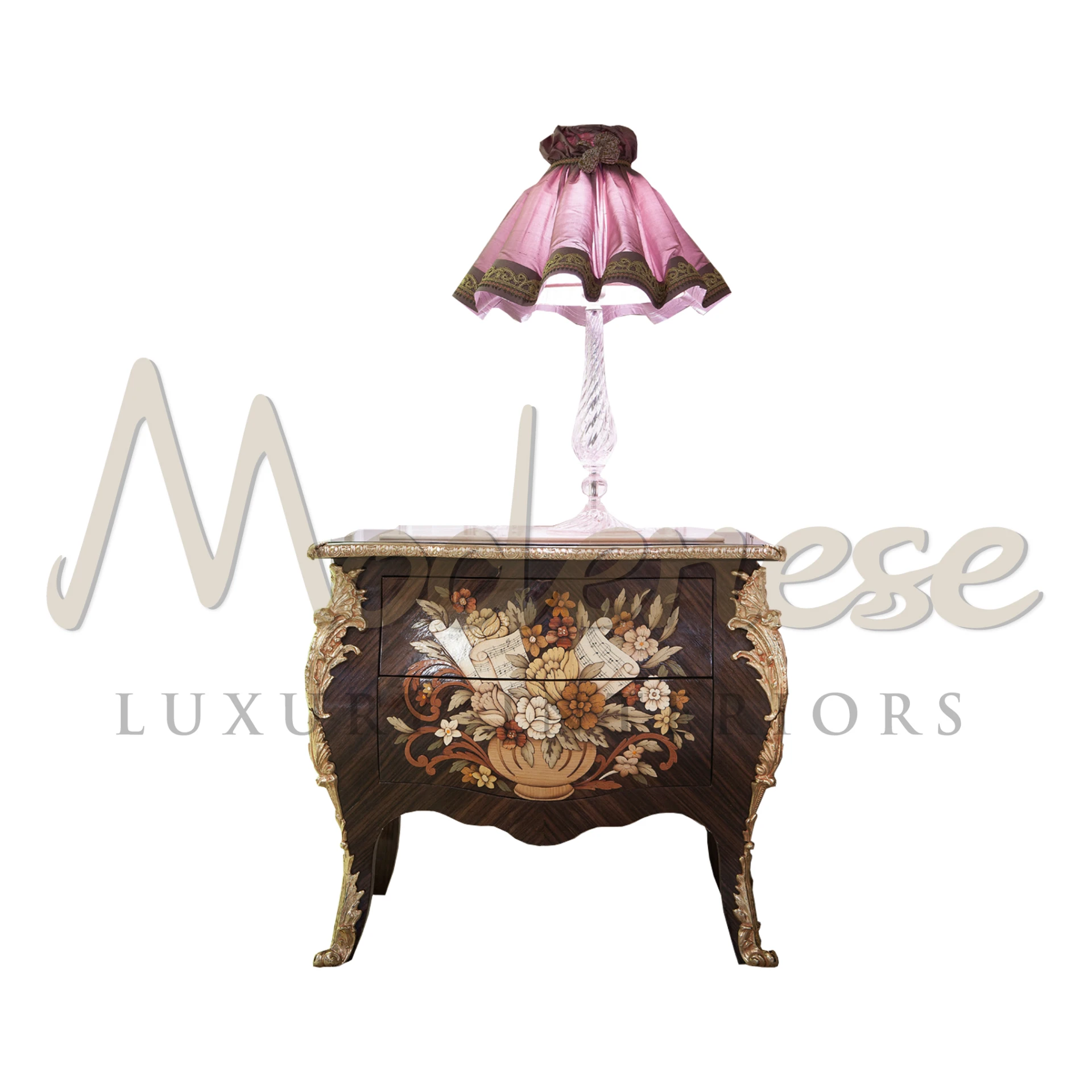 Classic wooden nightstand with intricate floral marquetry and golden accents, featuring curved legs and a decorative pink table lamp with tassel details.