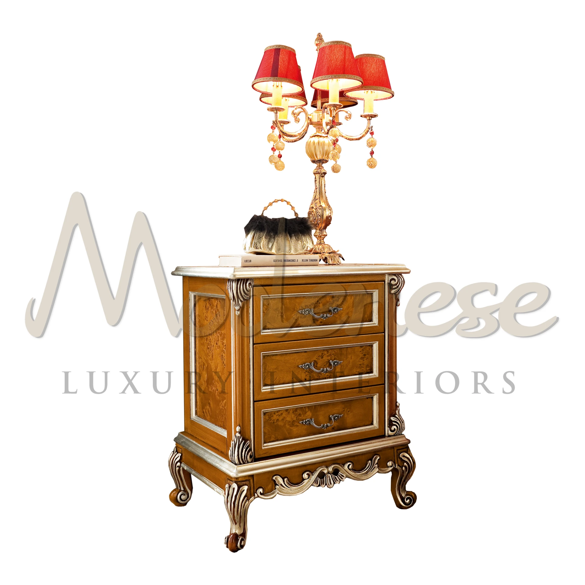 Ornate classic wooden nightstand with burl wood inlays, carved golden accents, traditional drawer handles, and a luxurious red-shaded candelabra table lamp on top.