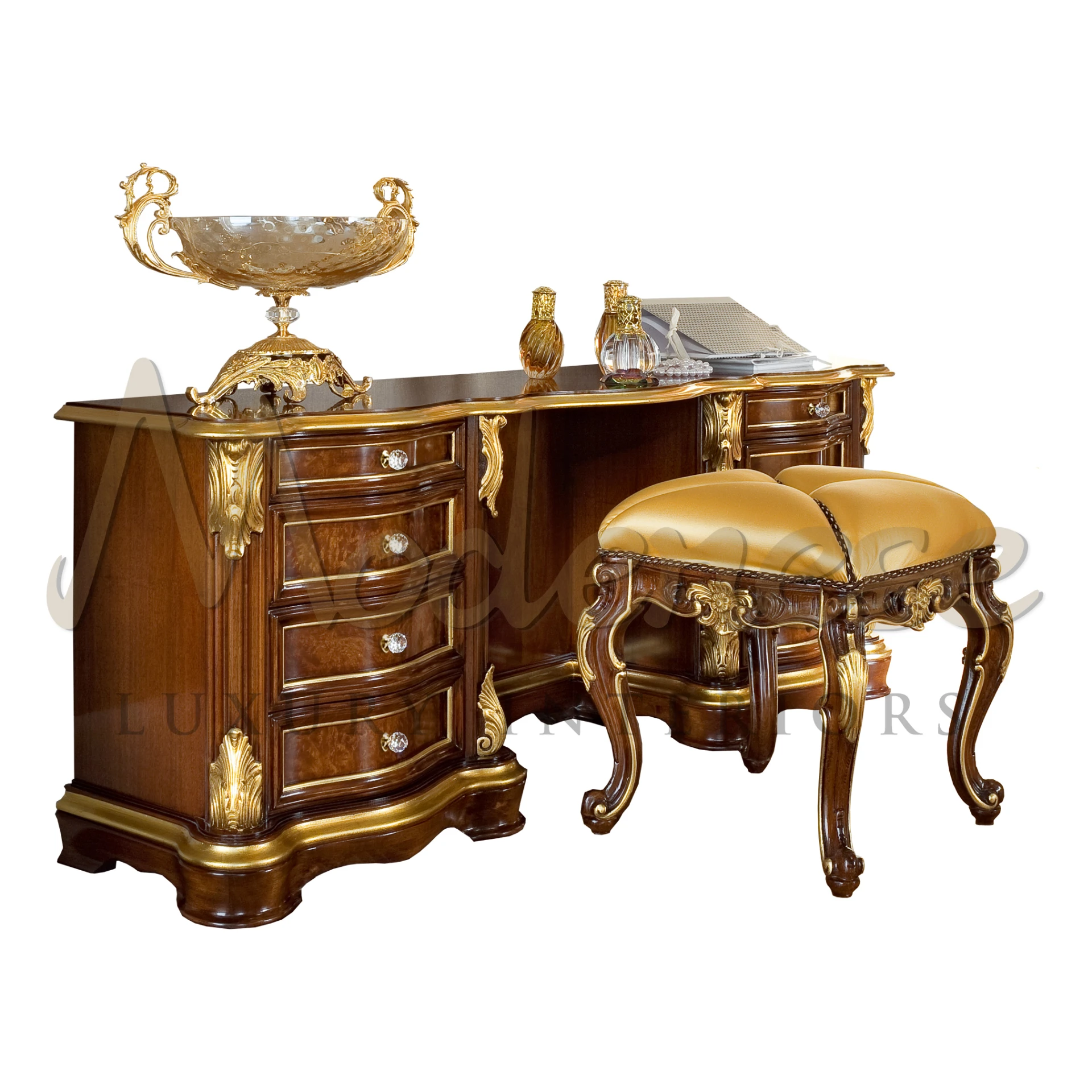 Elegant mahogany dressing table with gold leaf accents, multiple drawers, and a matching stool with a golden cushion, adorned with a large decorative gold bowl and perfume bottles.