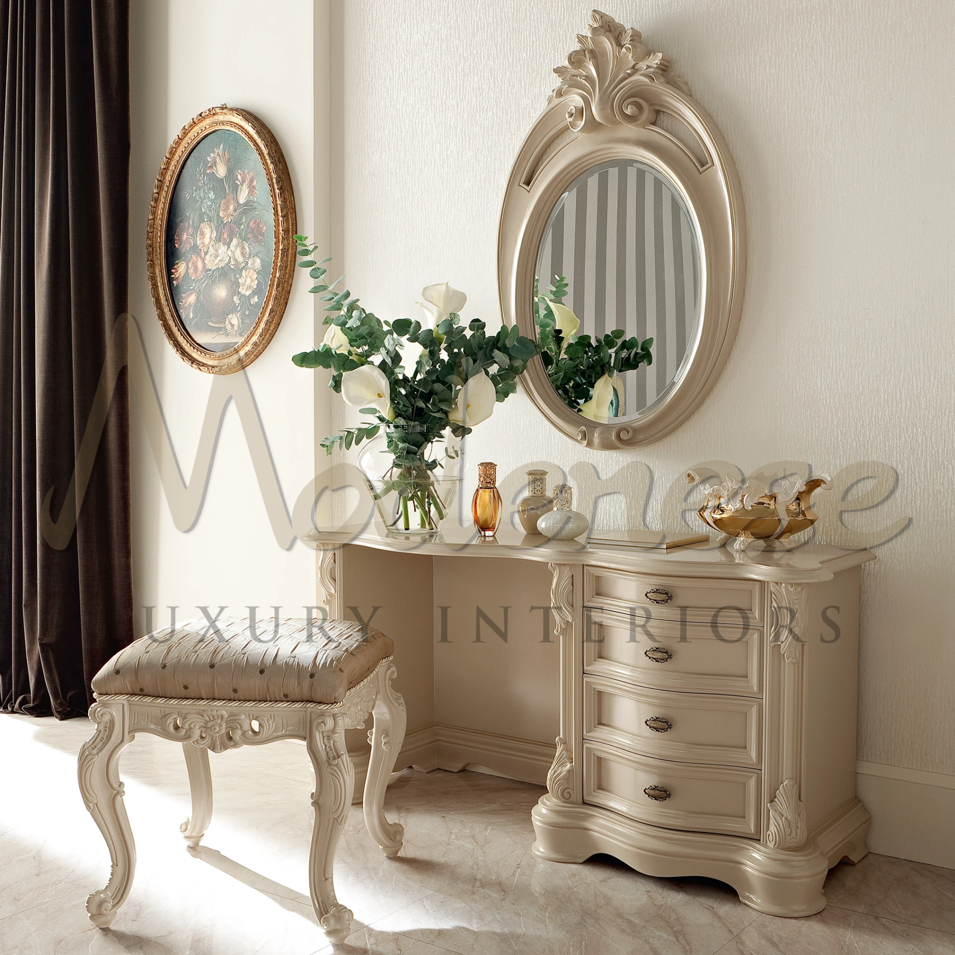 Soft-toned dressing table with elegant curves and detailed craftsmanship, paired with a textured upholstered stool and an array of delicate table-top accessories.