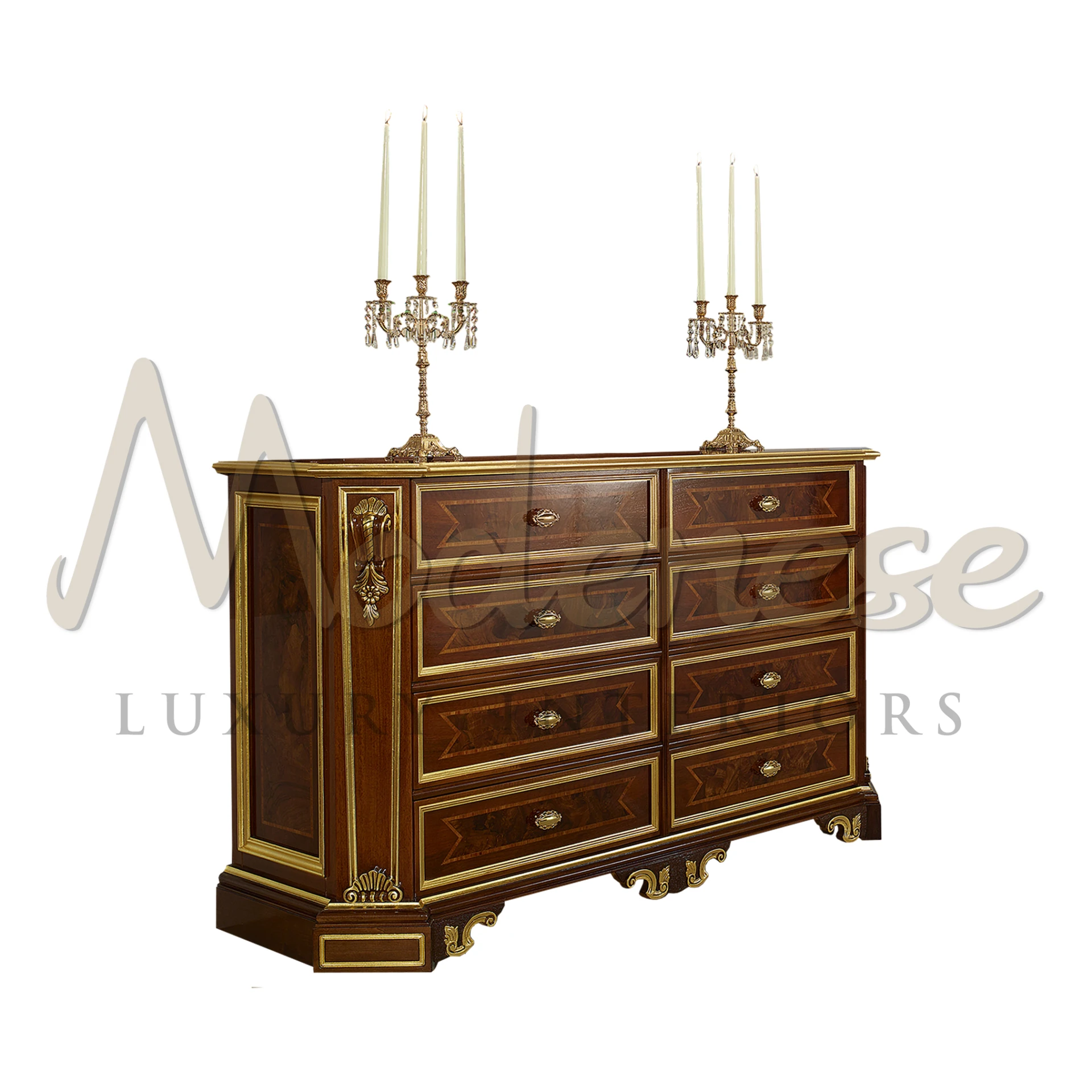 Traditional wood chest of drawers with brass handles and ornate candlestick holders on top.