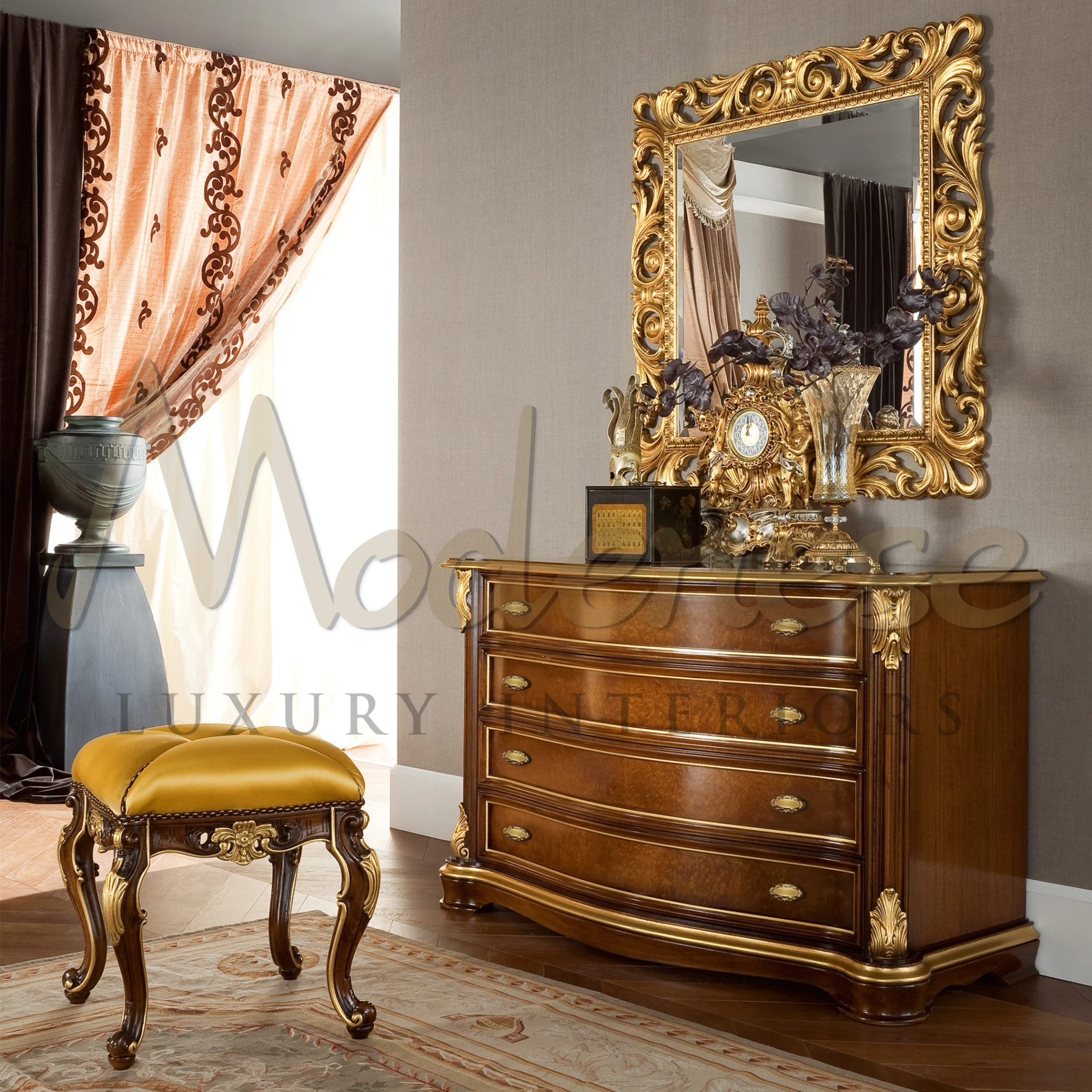 An luxurious bedroom setting featuring an ornate chest of drawers and mirror.