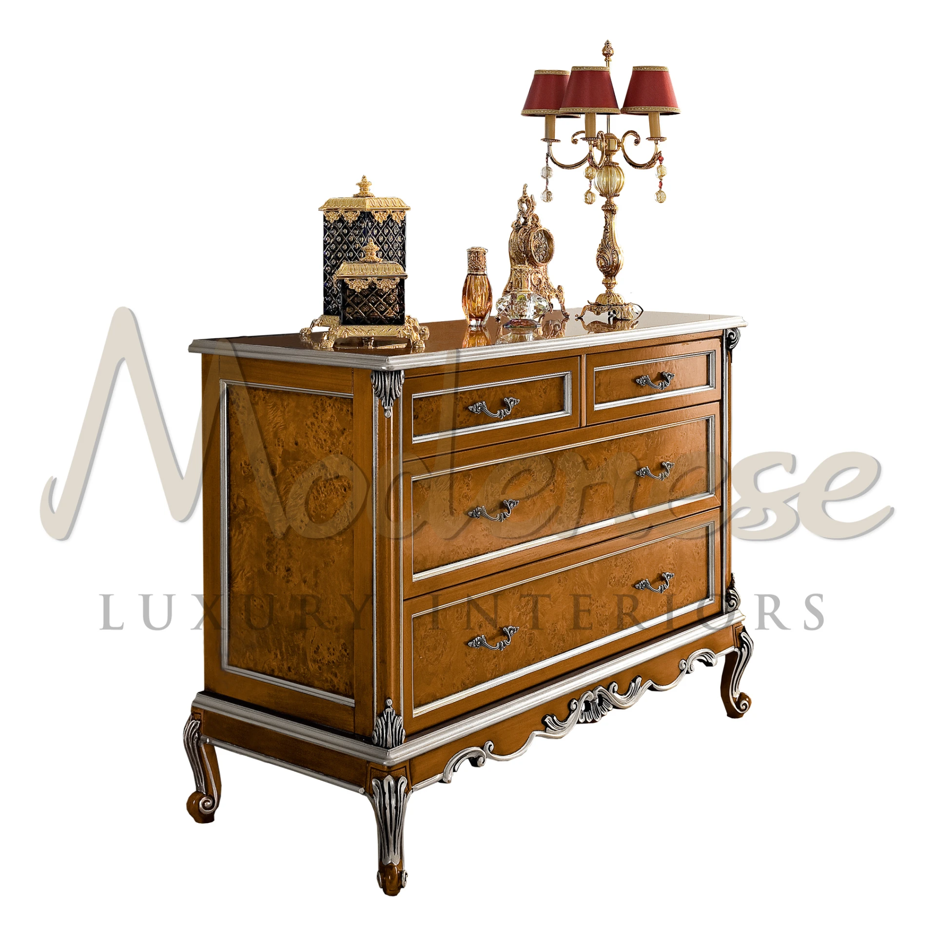 Traditional burl wood dresser with ornate silver handles and a decorative tabletop display.