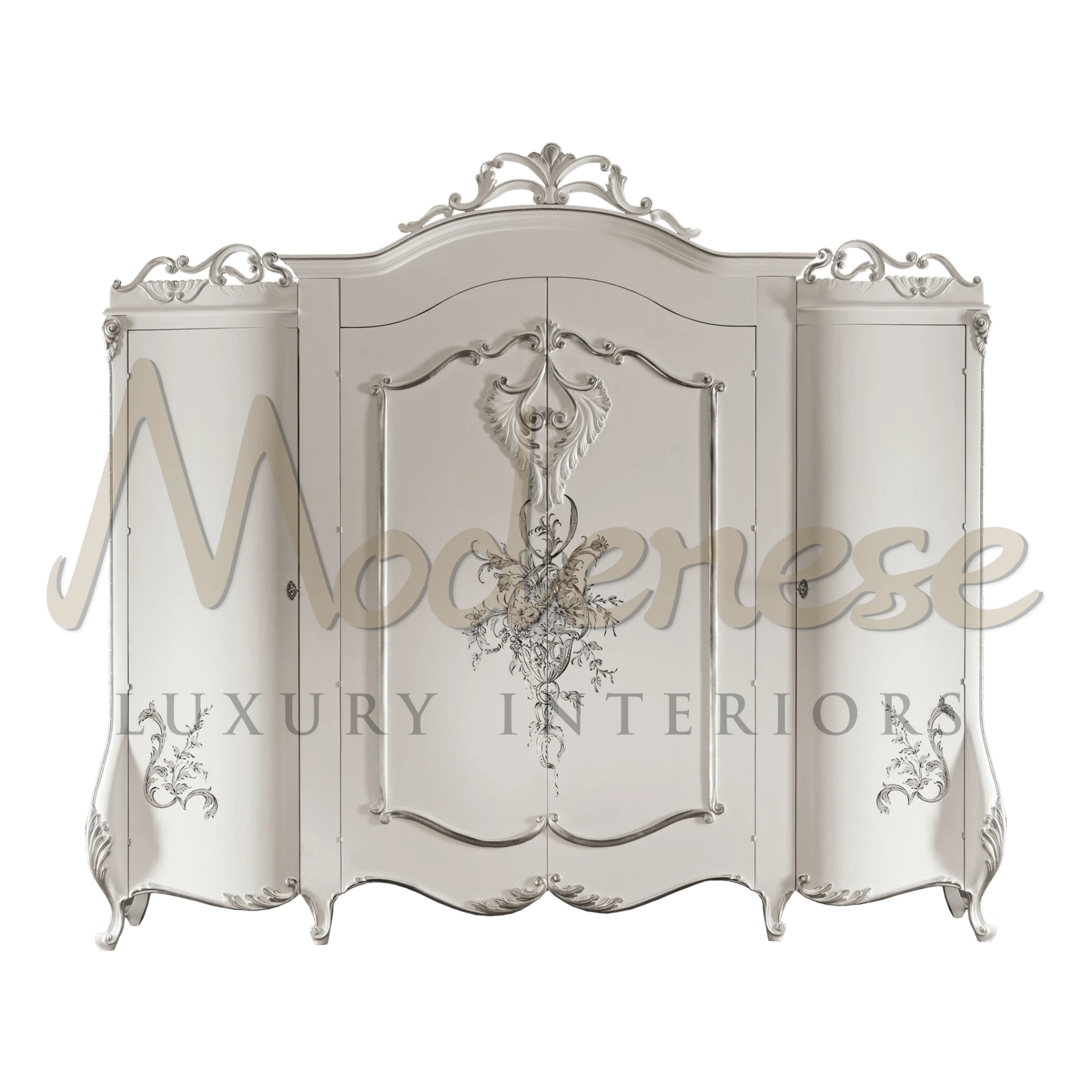 Ornate silver wardrobe with central floral carving and curved lines.                                                                                  