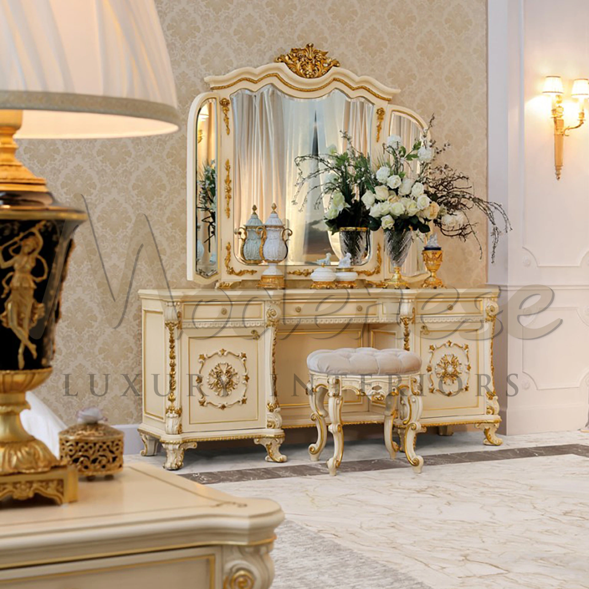 Chic padded vanity seat with creamy tufting and curvaceous gold-trimmed legs.                                                                         