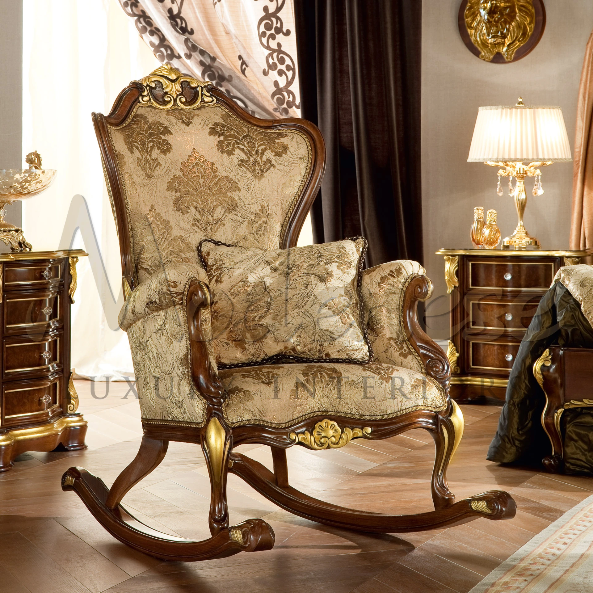 Ornately carved wooden rocking chair with golden upholstery and floral patterns, featuring a cushioned seat, backrest, and a decorative top crest.