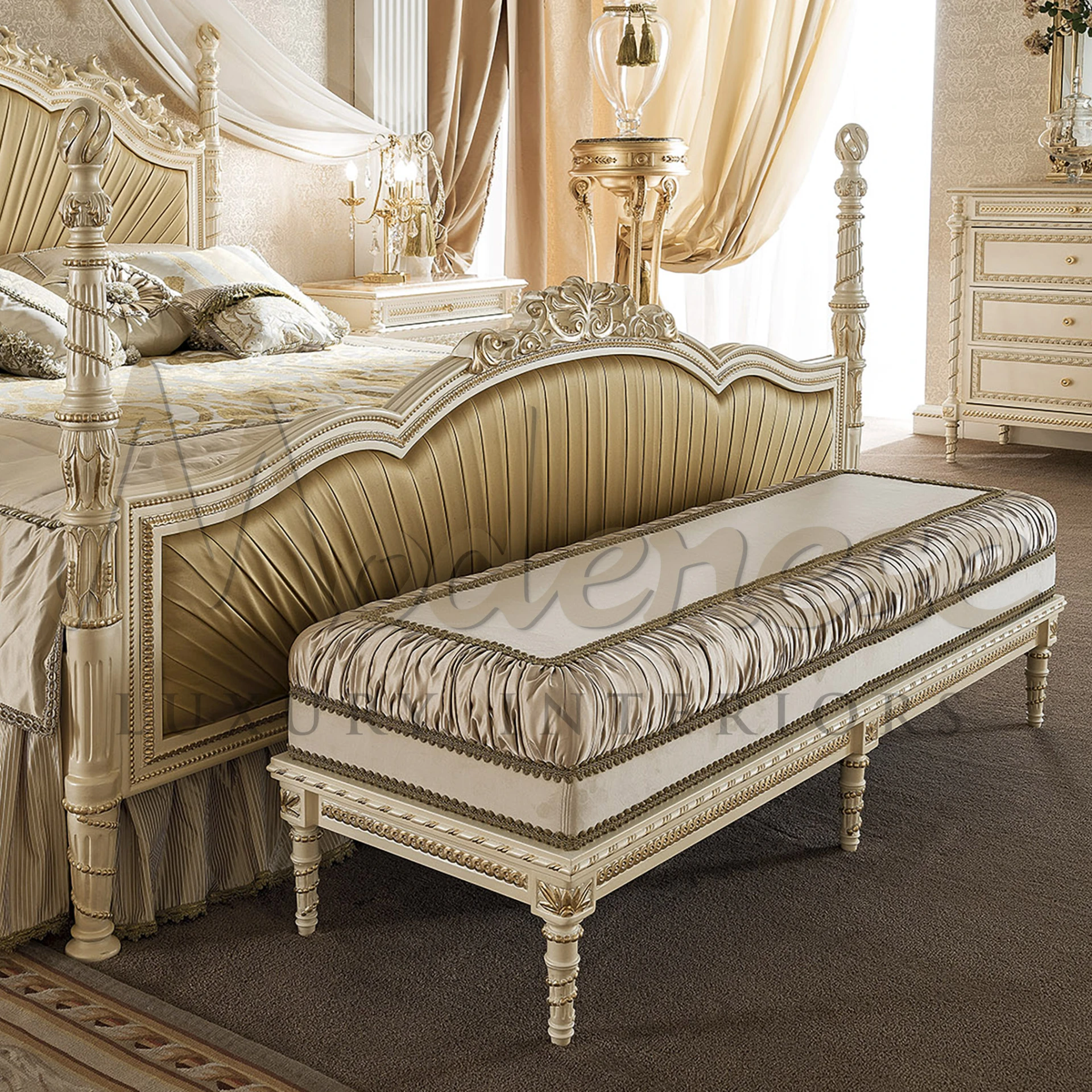 Traditional long bench with fringed beige fabric and carved leg design.                                                                               