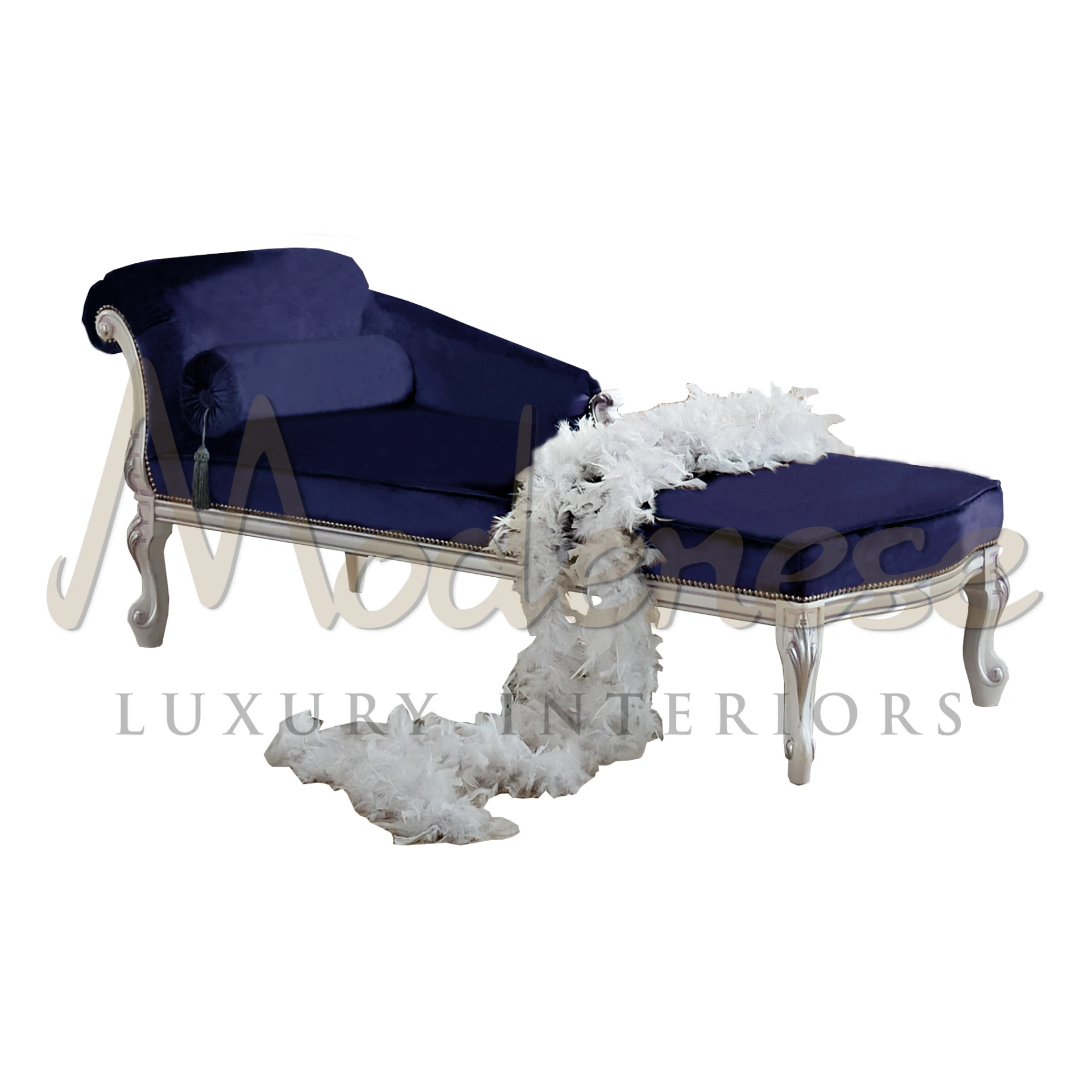 Royal blue velvet chaise lounge with white carved wood frame.                                                                                             