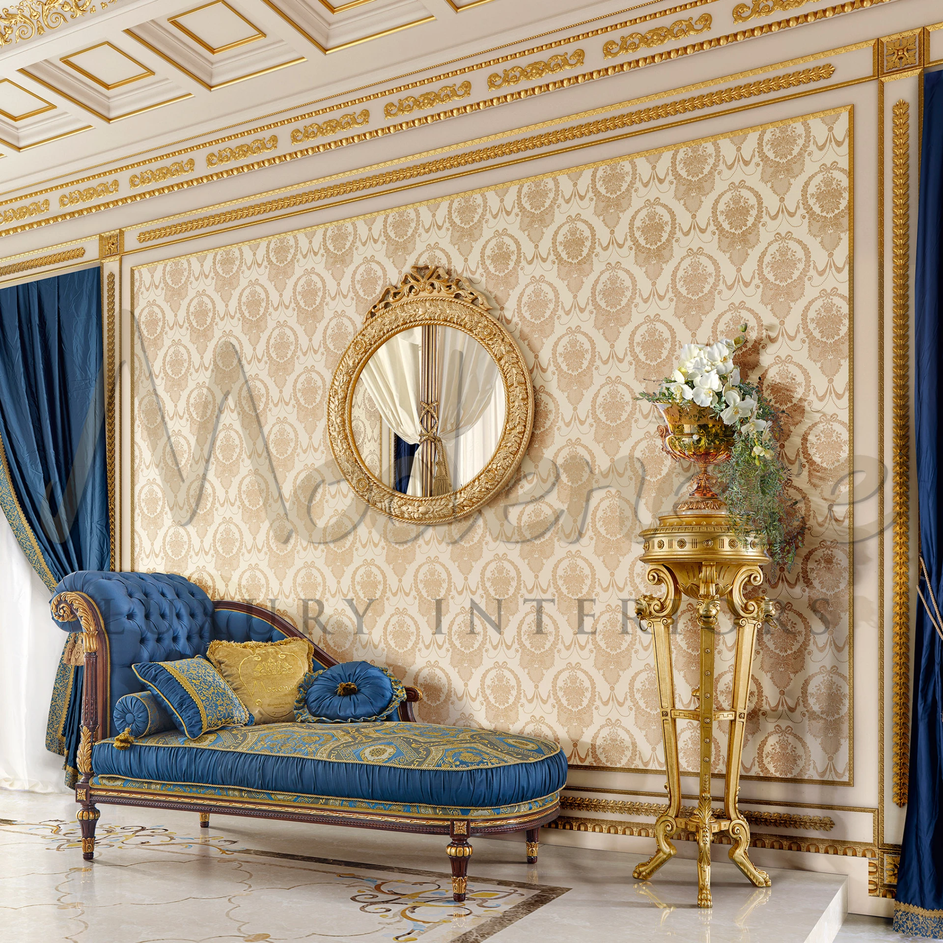 Classic chaise lounge with rolled armrest and blue and gold fabric design.                                                                                     