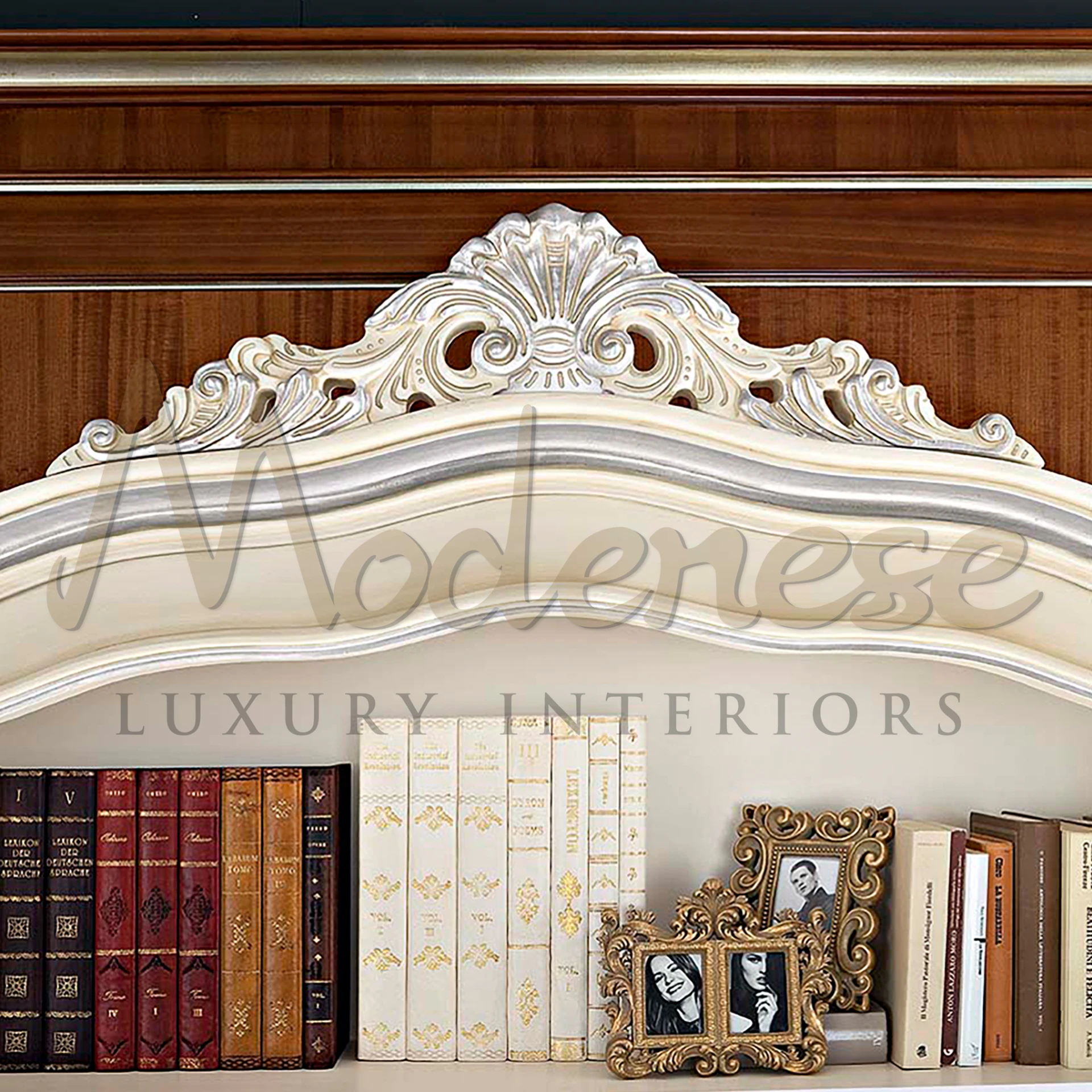 A stylish ivory and gold bookcase filled with books and various items by Modenese Luxury Furniture