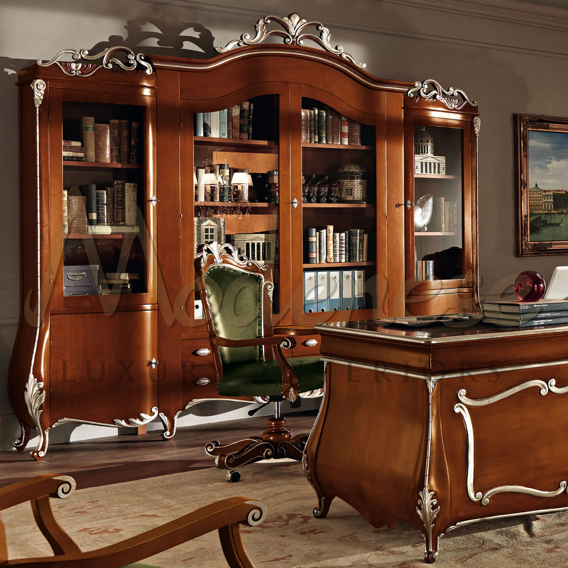 A well-furnished office room showcasing a desk, chair, and a cherrywood finishing, silver leaf details majestic Bookcase by Modenese Luxury Furniture.