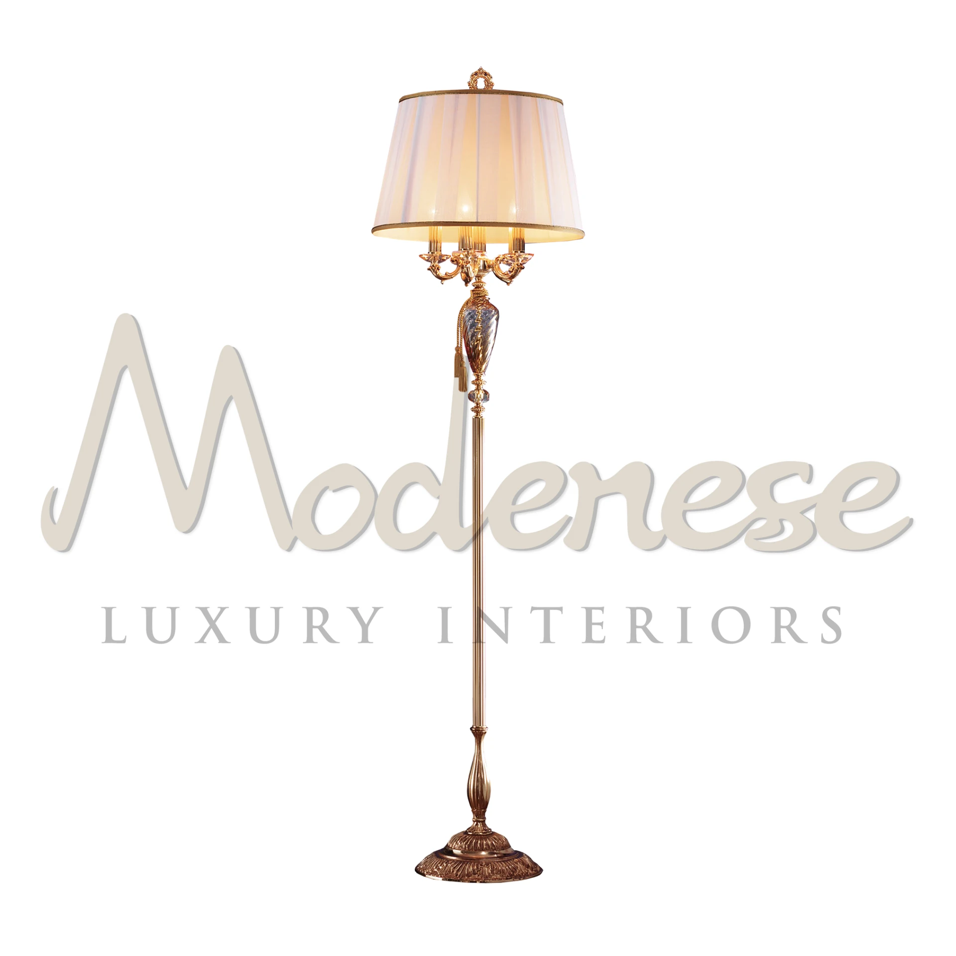Modenese’s Amber Lamp with french golden base and soft glowing bulbs.