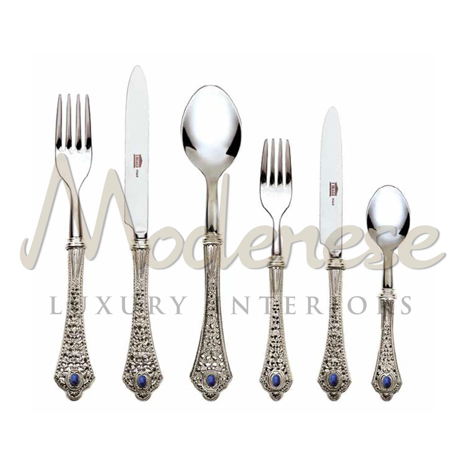 Elegant 'Exclusive Silver Cutlery Set' with intricate handle designs & blue gemstone.