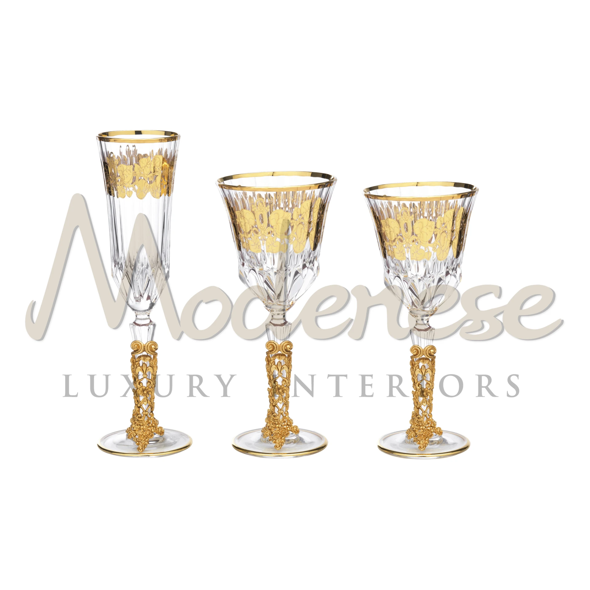 Three modish crystal glasses with golden details