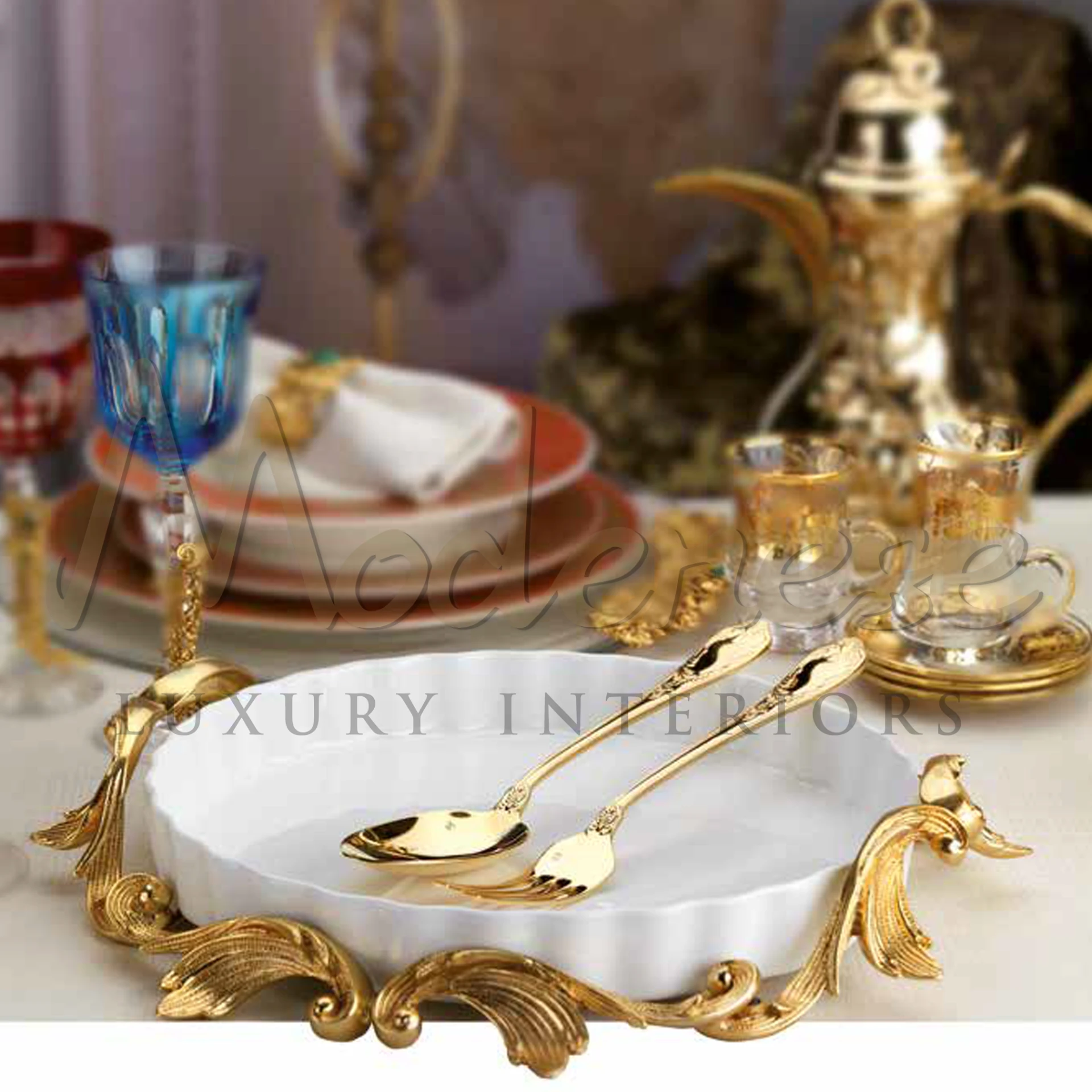 A luxurious dining table setting with golden cutlery and elegant tableware.