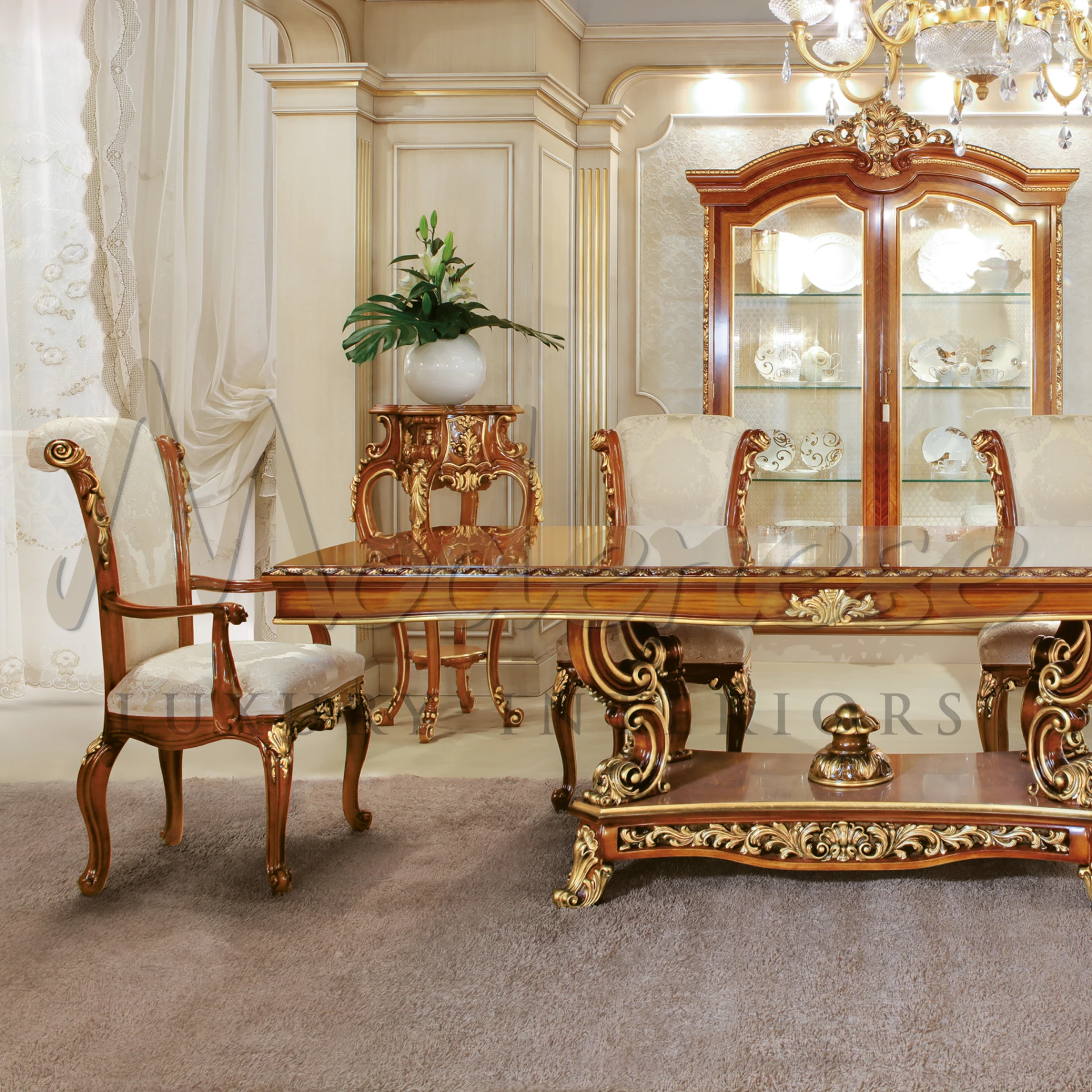 Luxurious dining room with a crystal chandelier and ornate furniture by Modenese Luxury Furniture.
