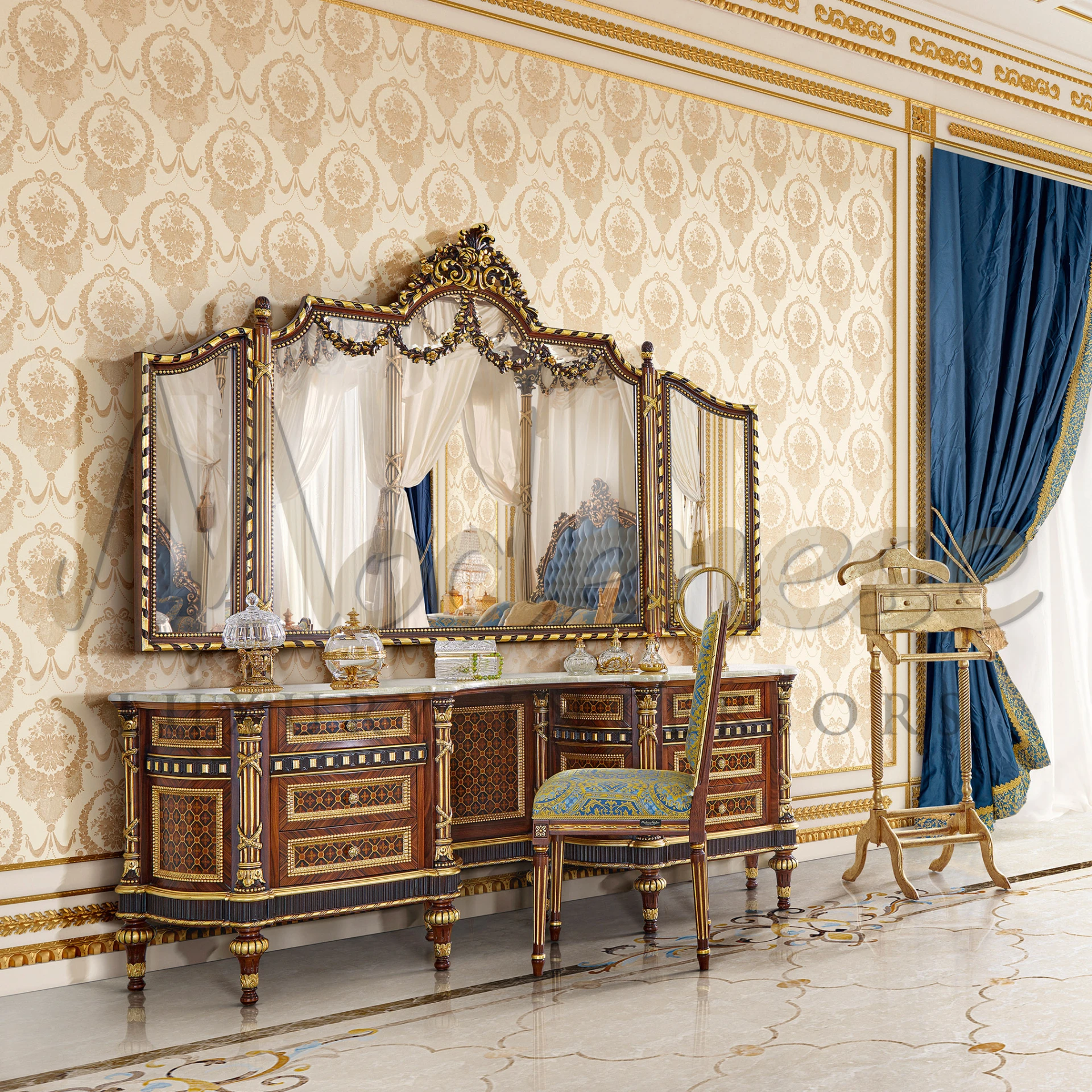 Detailed view of a white and gold table with a decorative floral design with Baroque Chair with fancy fabric.