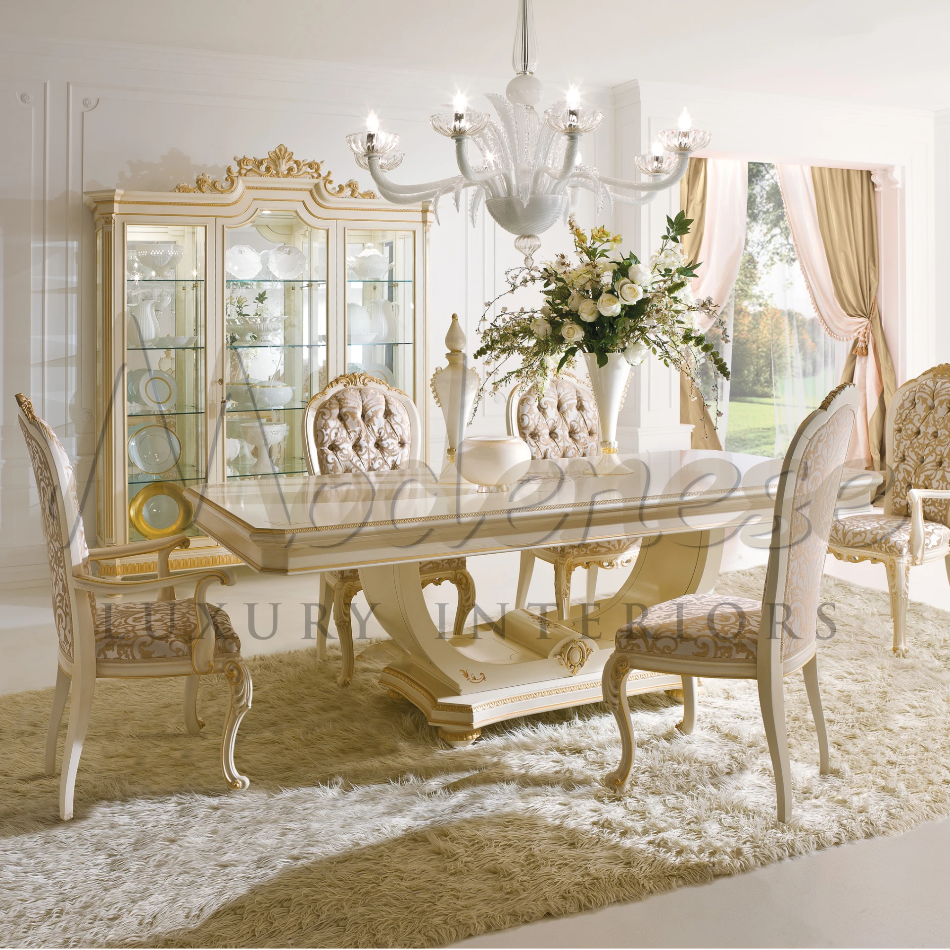 Luxurious Venetian style dining set with cream and gold design details and crystal chandelier.