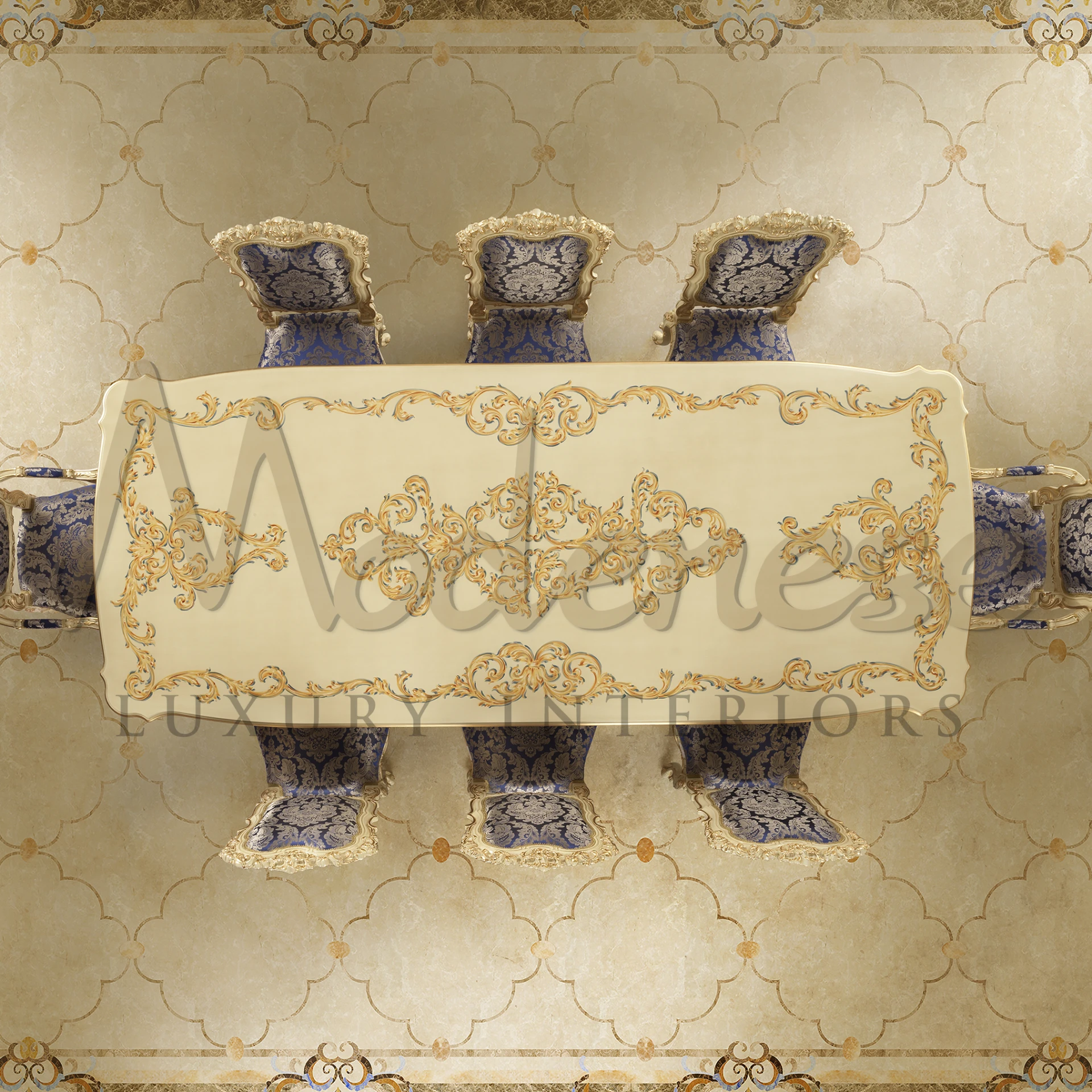 Close-up view of a luxurious round marble table top with finely hand carved chairs with patterned fabric.