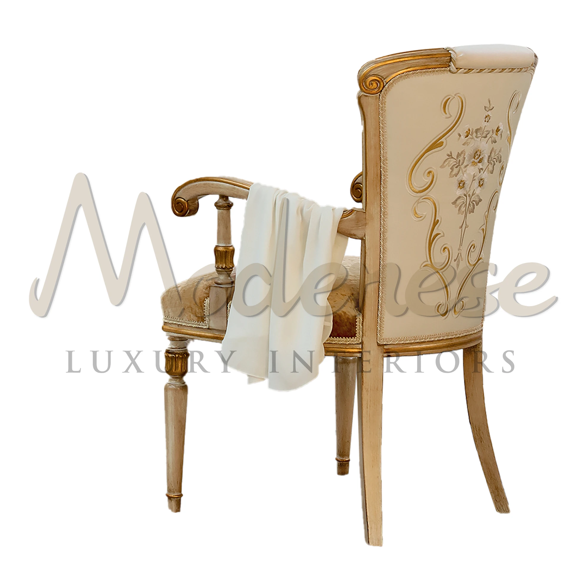 Luxurious hand carved chair with armrests with intricate detailing and golden floral pattern