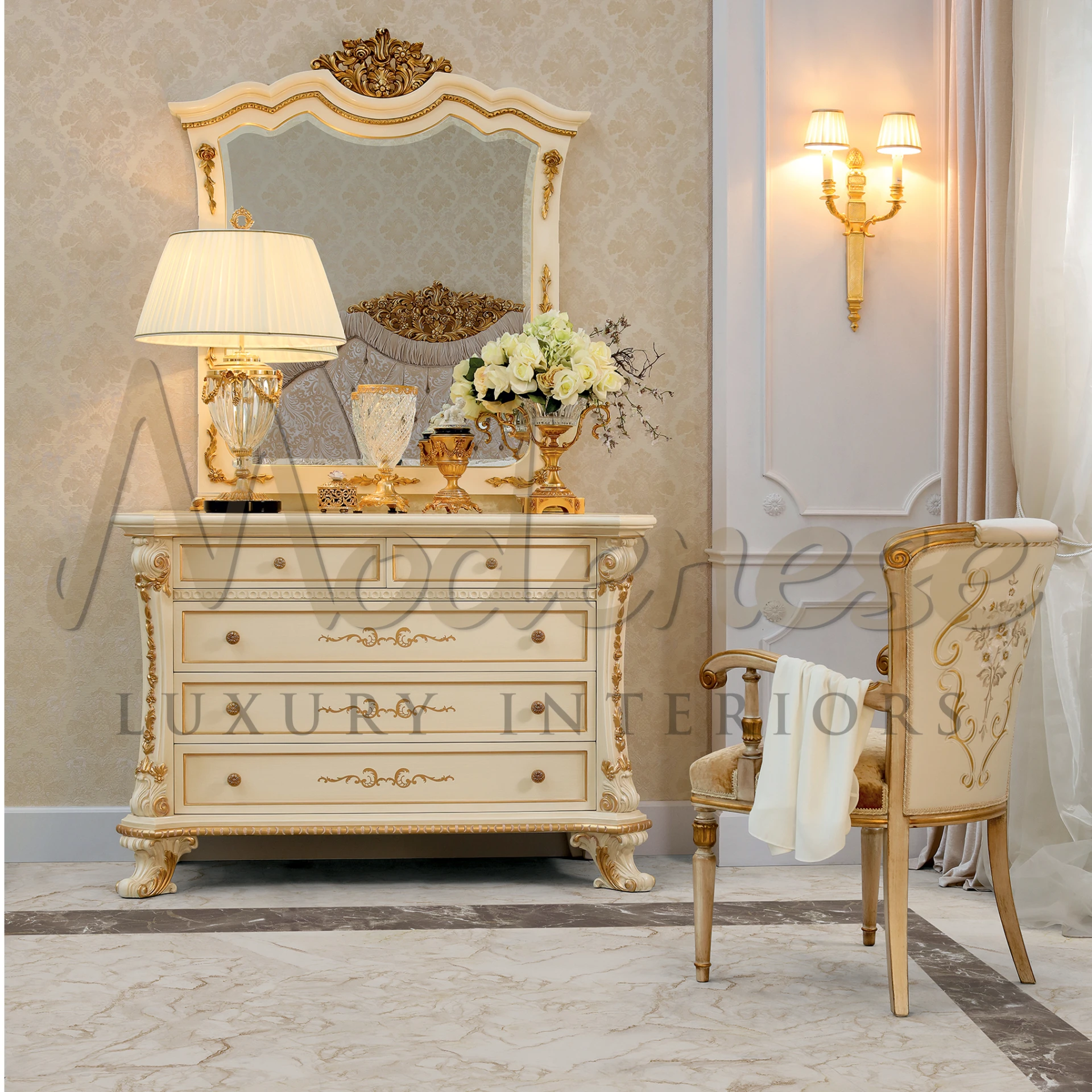 A classic cream and gold dresser with fancy decor, a matching mirror, and wall mount lighting.