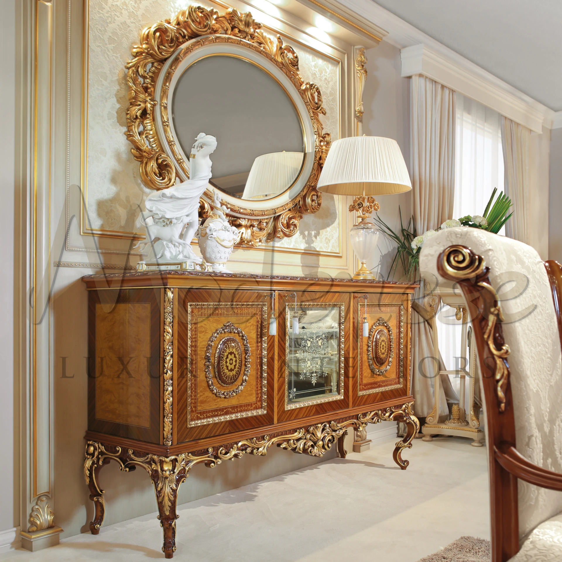 Luxurious Wooden Sideboard with hard designs, furnished by a golden framed mirror and elegant lamp.