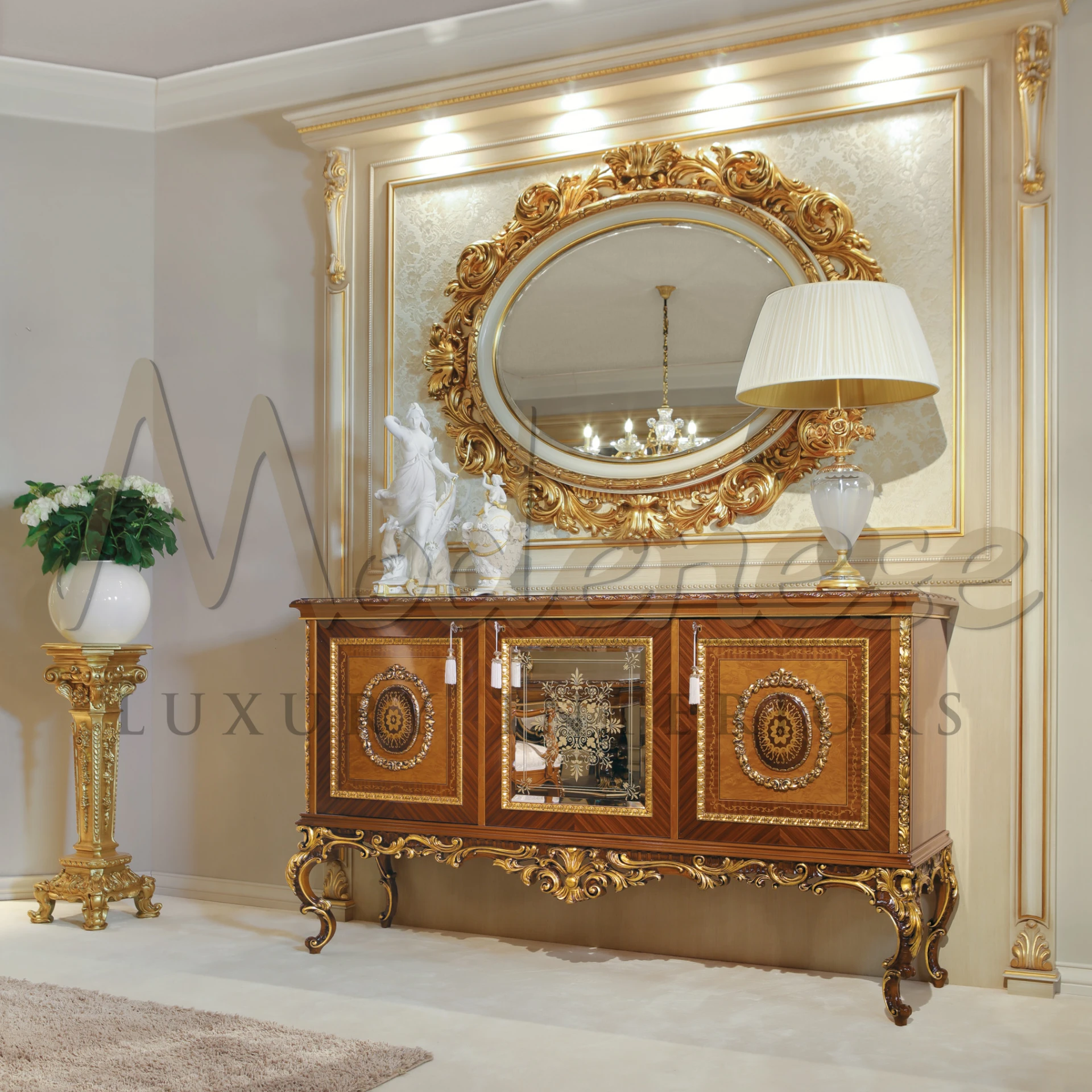 A living room displaying a golden fancy mirror above an beautifully designed wooden cabinet.