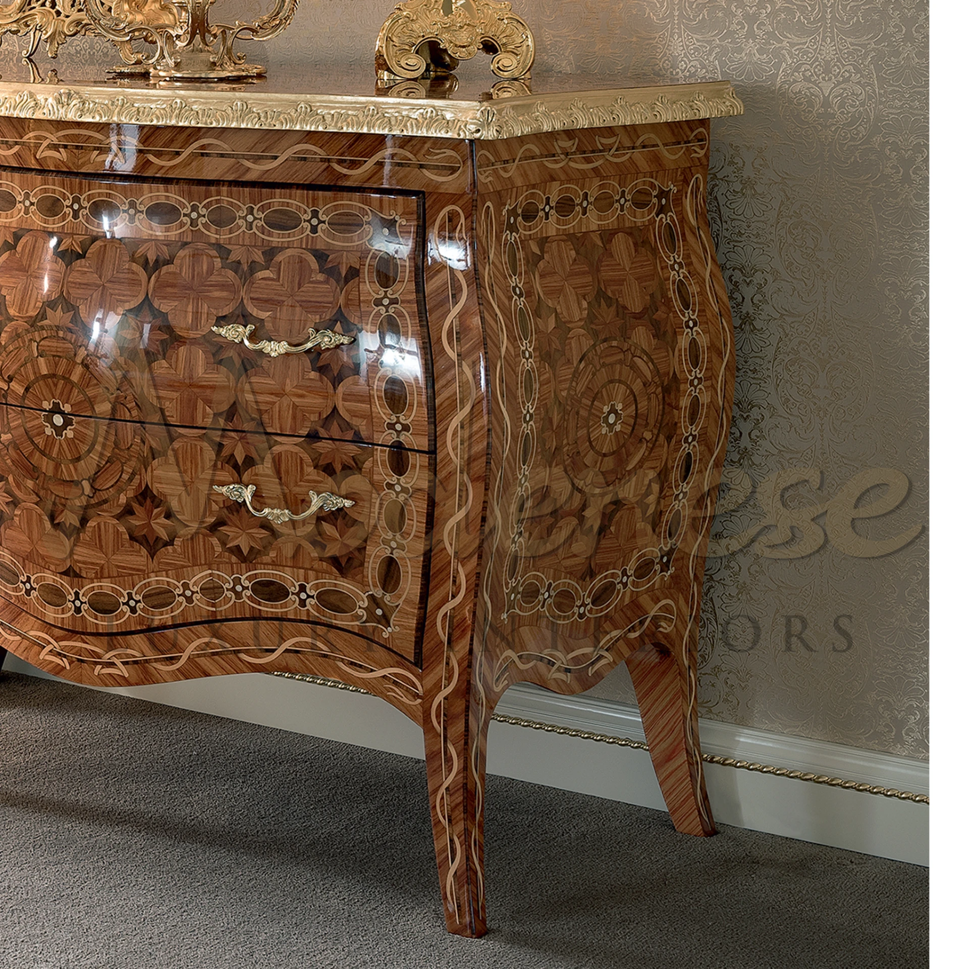 A close up view of hand carved wood sideboard showing its design pattern and golden details.
