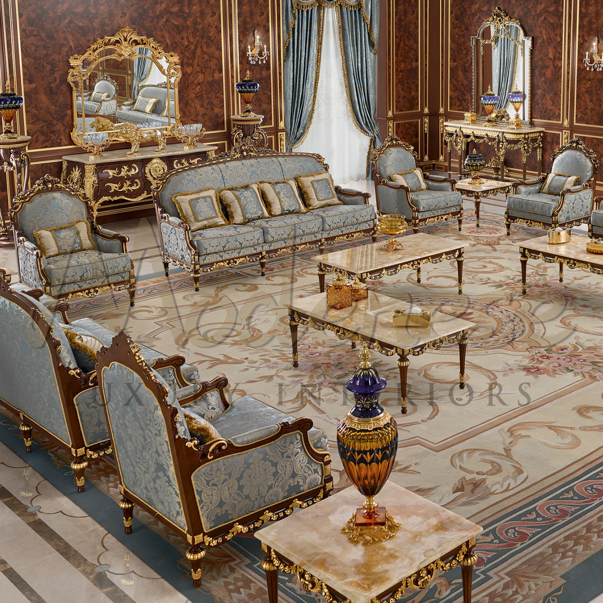 Luxurious sitting area with golden details furniture, with luxury blue fabrics, and an exquisitely patterned floor.