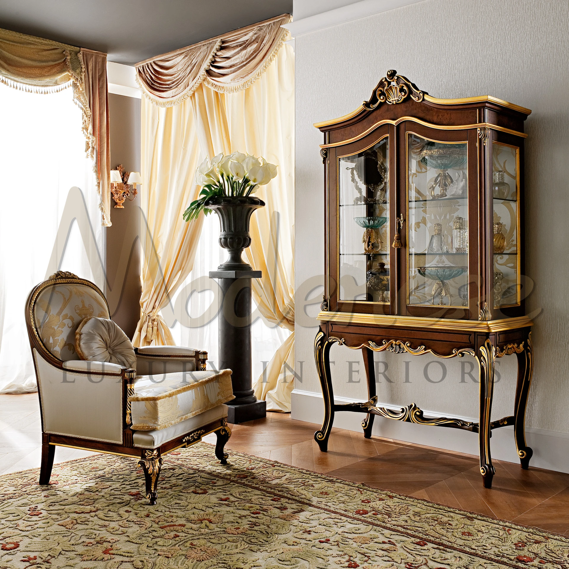 A classical room with traditional furniture, including a chair and an Imperial showcase secretaire with glass doors.