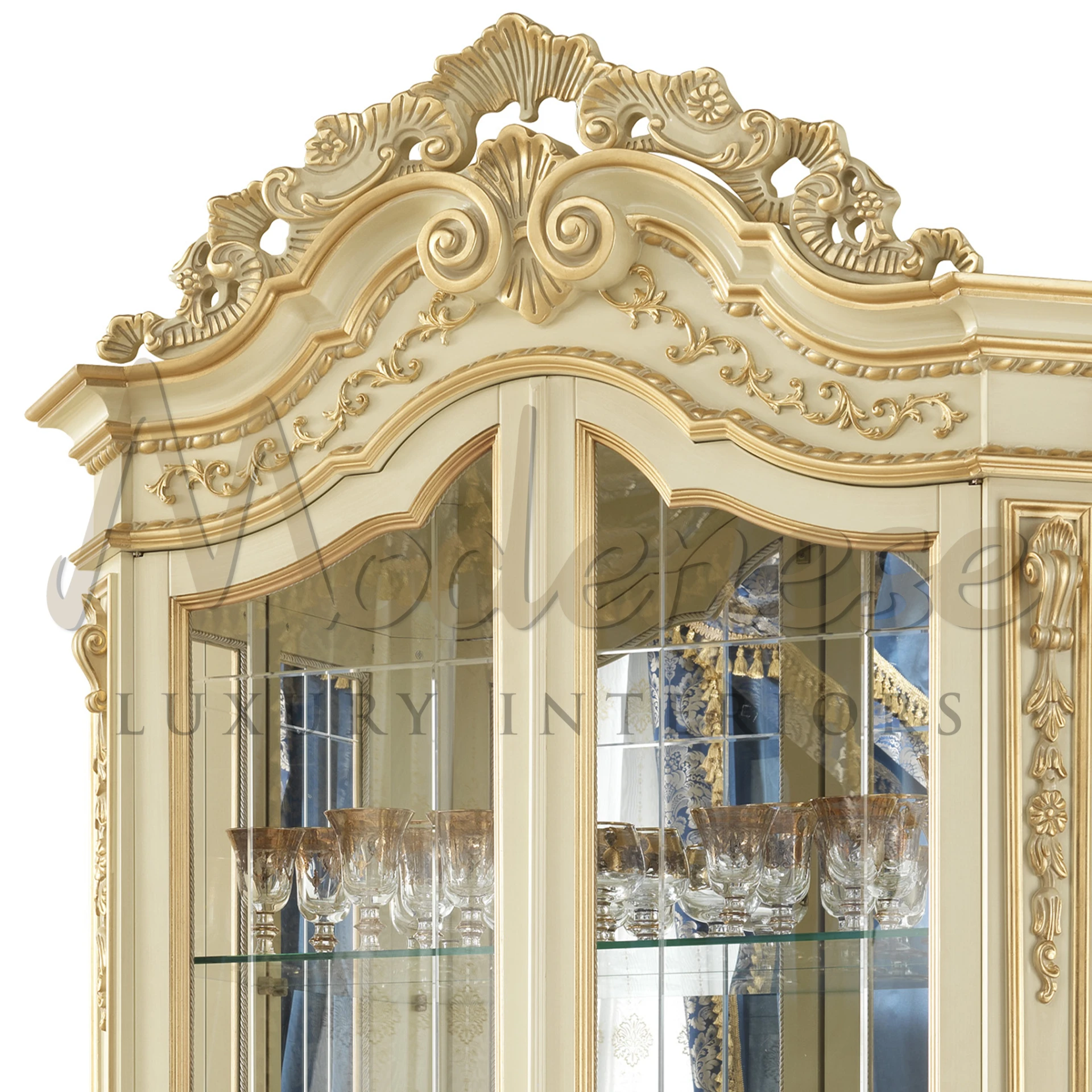 a close up view of the luxury ivory cabinet top showing fancy design with golden details
