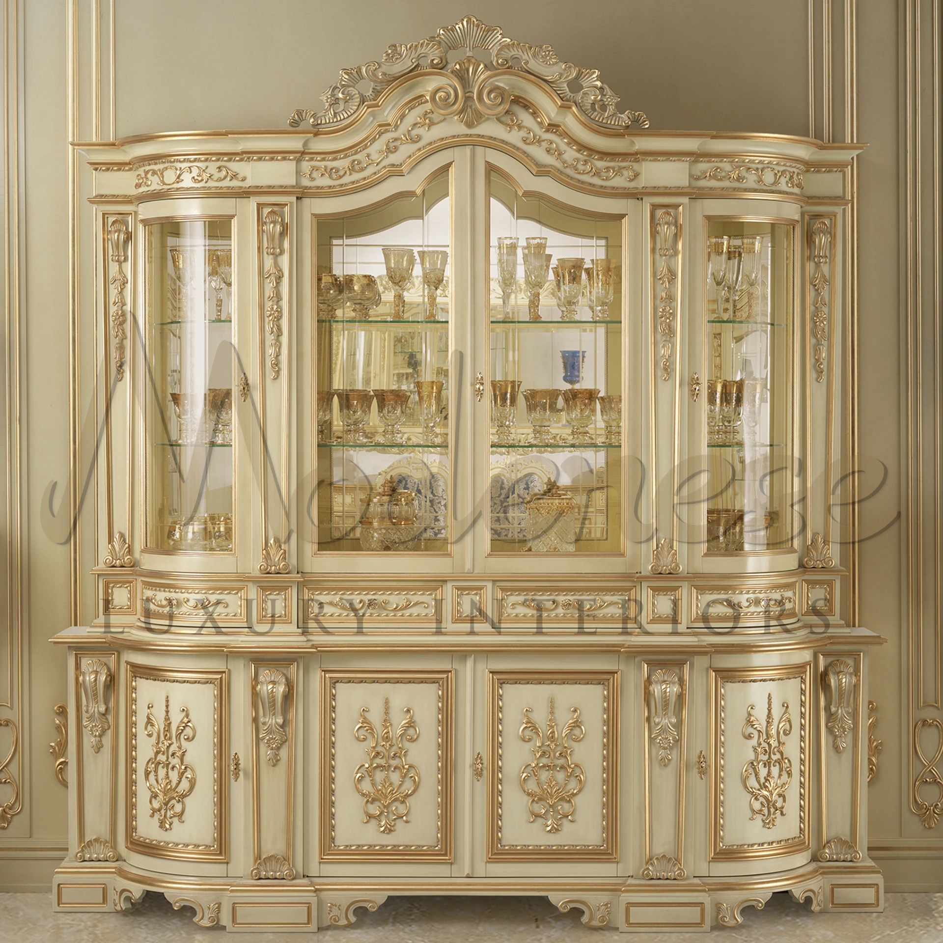 luxurious ivory cabinet with decorative carvings and glass display sections.