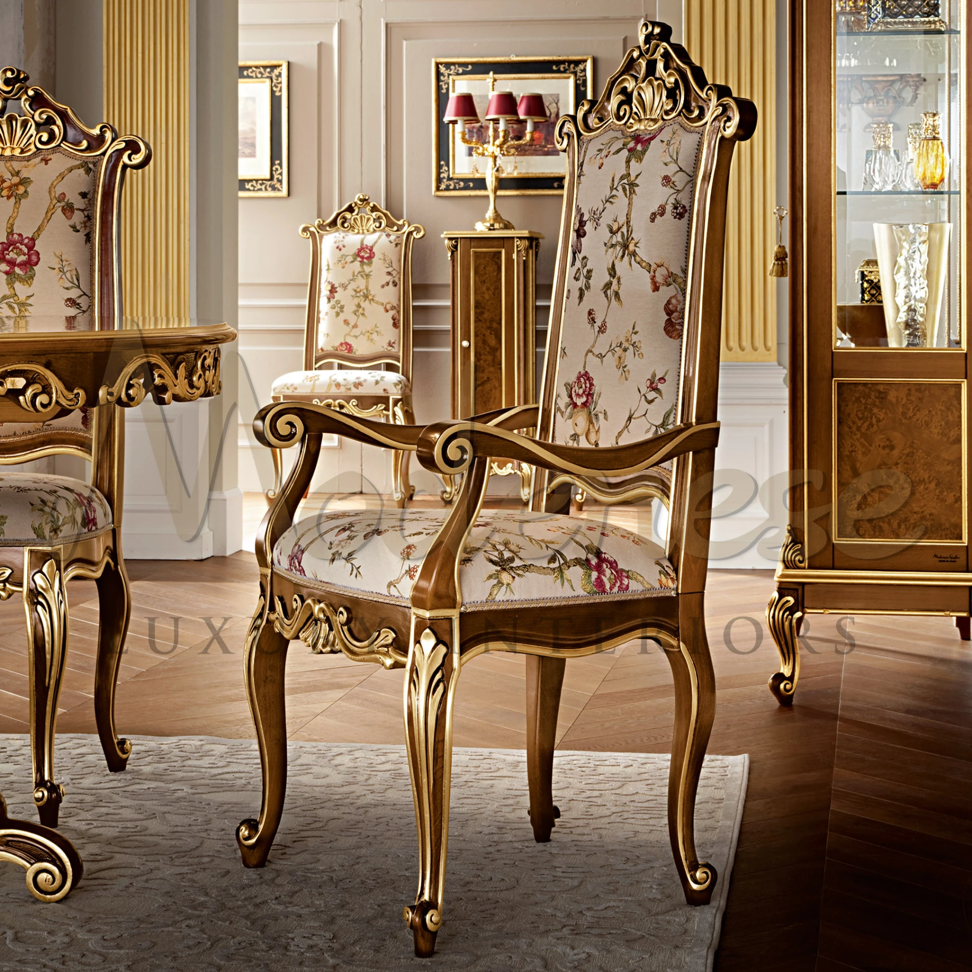 Indulge in luxury with our majestic armchair, boasting gold leaf detailing, walnut finish, and plush floral upholstery.