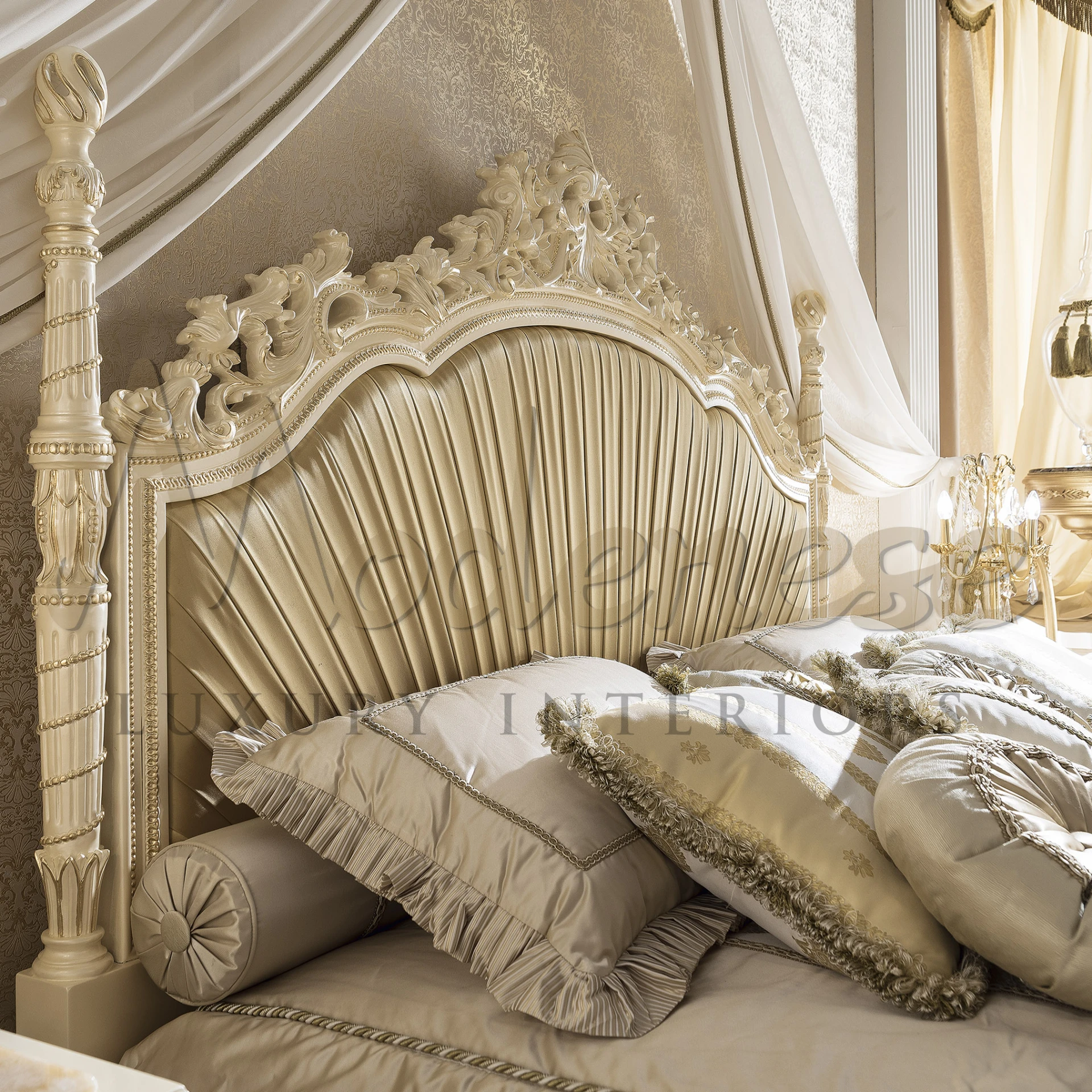 An ornate classical beige double bed with elaborate carvings and plush bedding, featuring a high headboard and bed skirt, showcasing luxurious design.