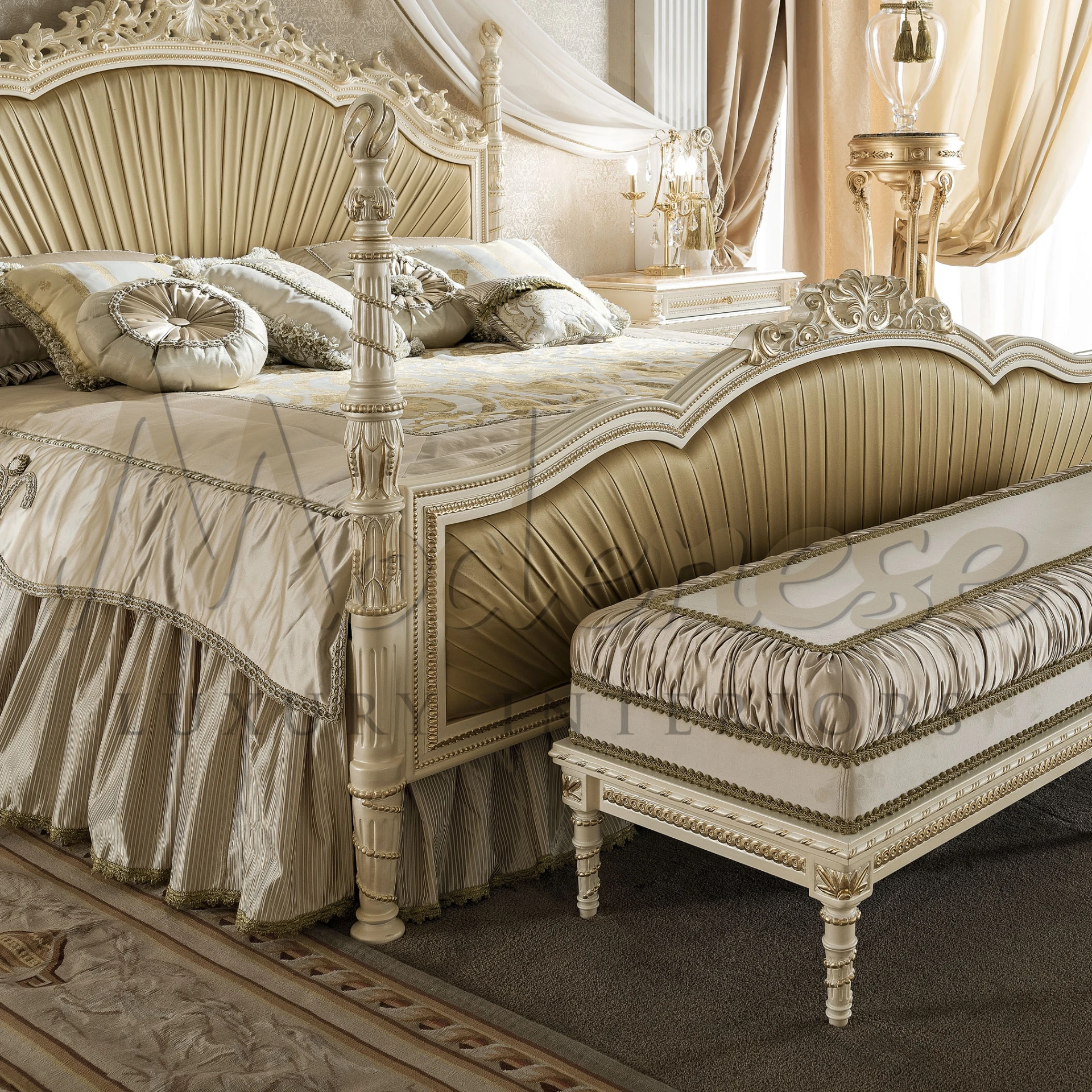 A luxurious bedroom featuring an ornate cream-colored bed with a high, sculpted headboard and matching footboard, both decorated with fluted details and carved accents. 